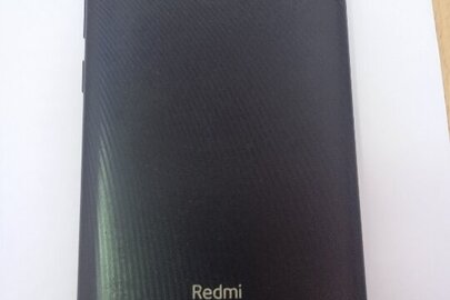 Конфіскація майна за рішенням суду: Мобільний телефон марки «Redmi», в корпусі чорного кольору, б/в.