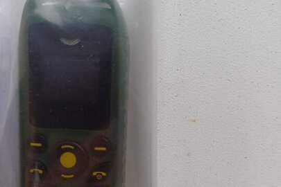 Конфісковане майно за ухвалою суду: мобільний телефон невідомої марки, моделі "В25", б/в