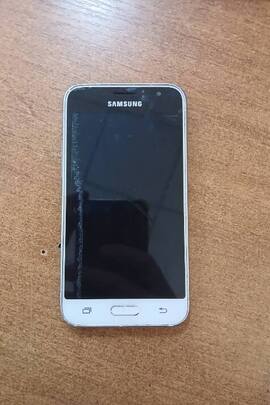 Конфіскація майна за рішенням суду: мобільний телефон Samsung, білого кольору б/в