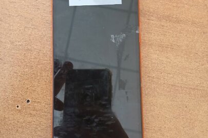 Конфіскація майна за рішенням суду: мобільний телефон Redmi, помаранчевого кольору, б/в