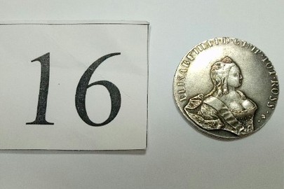 Монета з металу сріблясто-білого кольору, аверс-малюнок жінка, реверс малюнок двоглавого орла 1757, гурт гладкий