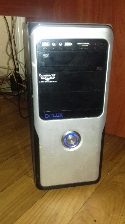 Системний блок Delux чорного кольору з сріблястими вставками, стан робочий