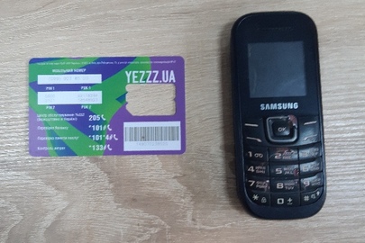 Мобільний телефон марки "Samsung", модель"GT-E1200", у корпусі чорного кольору —1 шт., б\в.