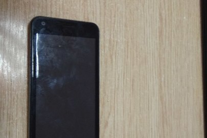 Мобільний телефон марки "Fly" fs 454 Nimbus 8, чорного кольору, IMEI:863594036362612. IMEI:863594036362620 в робочому стані, має незначні потертості