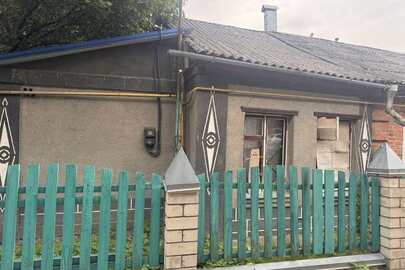 20/100 частин житлового будинку з господарськими будівлями та спорудами загальною площею 154,9 кв.м., житловою площею 97,9 кв.м. за адресою: Житомирська обл., м. Житомир, пров. Житній 1, будинок 4